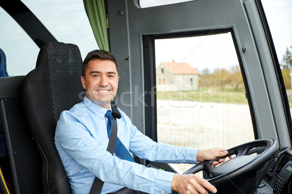 Stock photo: happy driver driving intercity bus