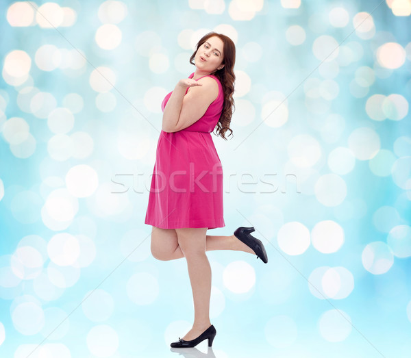 Stock photo: happy young plus size woman and sending blow kiss