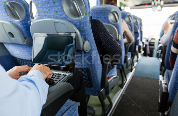 Stock photo: man with smartphone and laptop in travel bus
