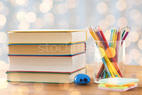 close up of crayons or color pencils and books Stock photo © dolgachov