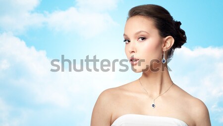 beautiful asian woman with earring and pendant Stock photo © dolgachov
