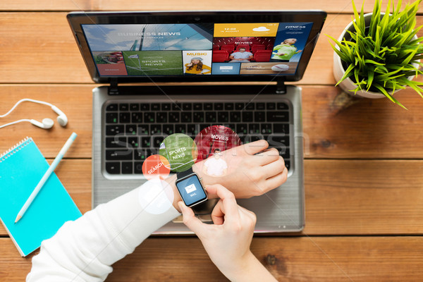 close up of woman with smart watch and laptop Stock photo © dolgachov