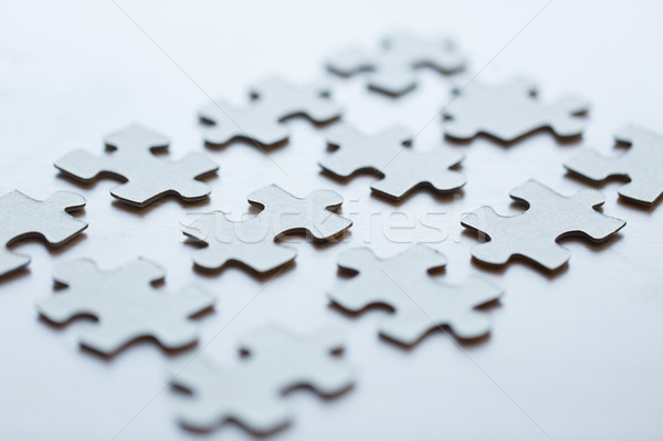 close up of puzzle pieces on table Stock photo © dolgachov