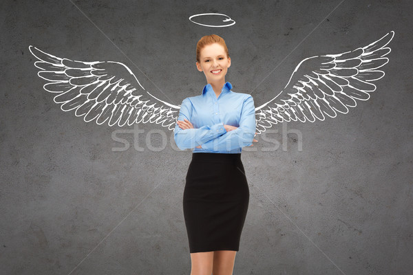 happy businesswoman with angel wings and nimbus Stock photo © dolgachov