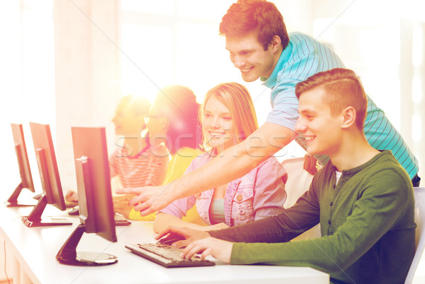 smiling students in computer class at school Stock photo © dolgachov