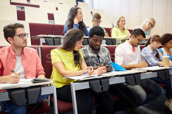 group of students with smartphone at lecture Stock photo © dolgachov