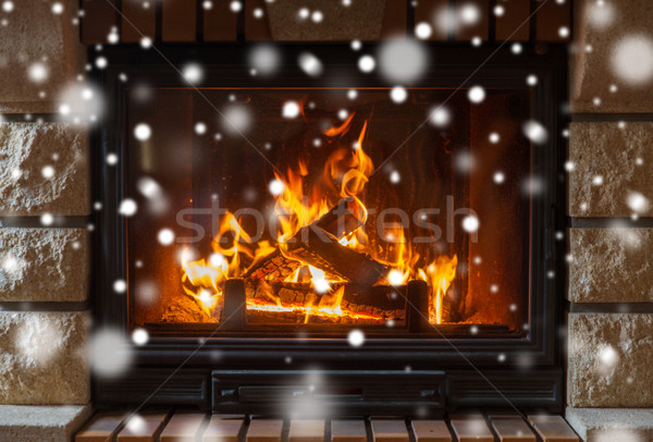 close up of burning fireplace with snow Stock photo © dolgachov
