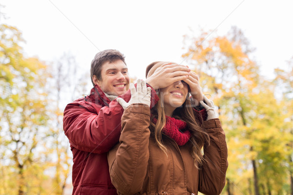 happy young couple having fun in autumn park Stock photo © dolgachov