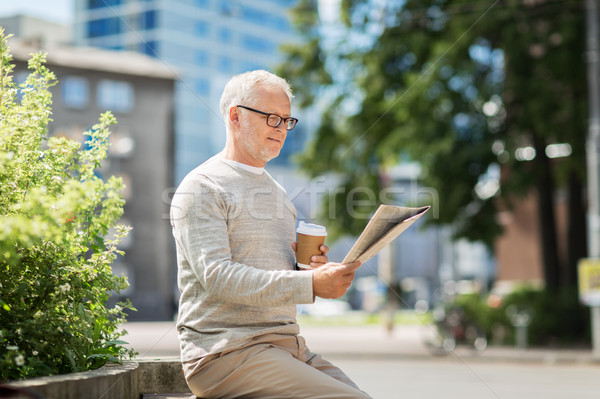 senior man reading newspaper and drinking coffee Stock photo © dolgachov
