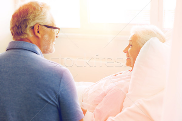 senior couple meeting at hospital ward Stock photo © dolgachov