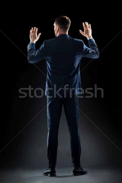 Biznesmen garnitur dotknąć coś niewidoczny ludzi biznesu Zdjęcia stock © dolgachov