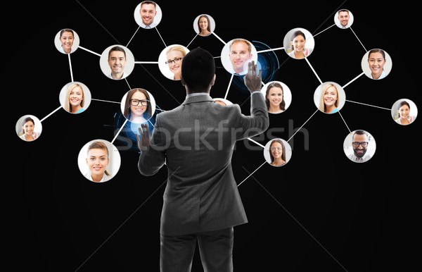 businessman working with network contacts icons Stock photo © dolgachov