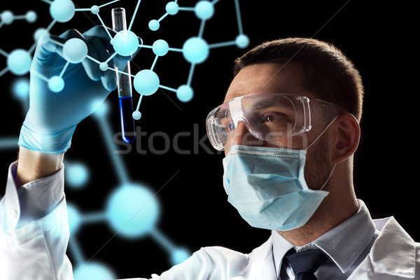 scientist with test tube and molecule projection Stock photo © dolgachov
