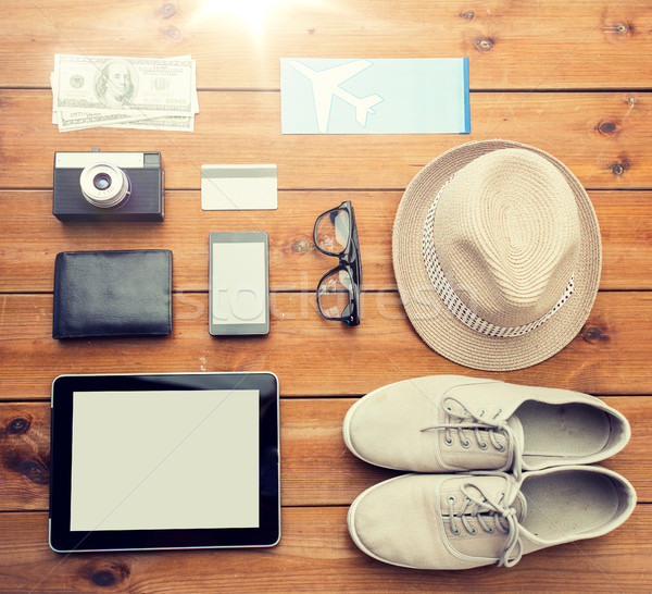 close up of gadgets and traveler personal stuff Stock photo © dolgachov