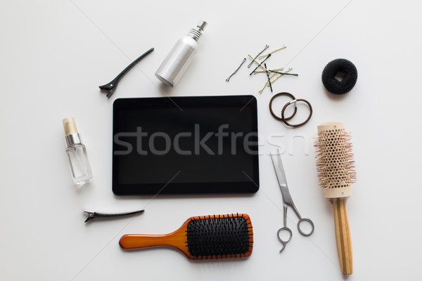 tablet pc, scissors, brushes and other hair tools Stock photo © dolgachov