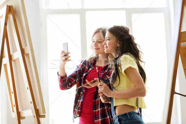 artist girls taking selfie at art studio or school Stock photo © dolgachov