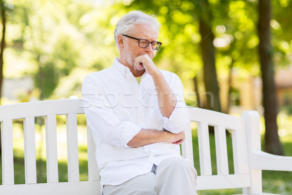 thoughtful senior man at summer park Stock photo © dolgachov