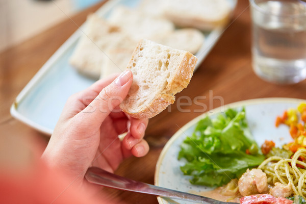 hand of woman holding piece of bread Stock photo © dolgachov