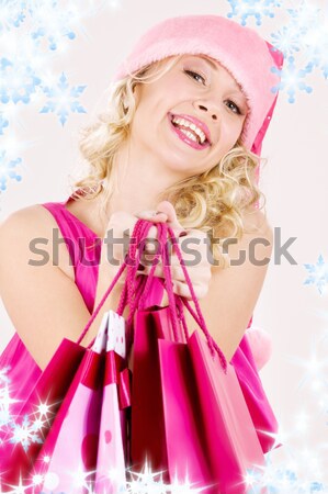 Stock photo: cheerful santa helper girl with gift box
