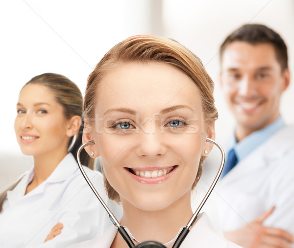attractive female doctor with stethoscope Stock photo © dolgachov