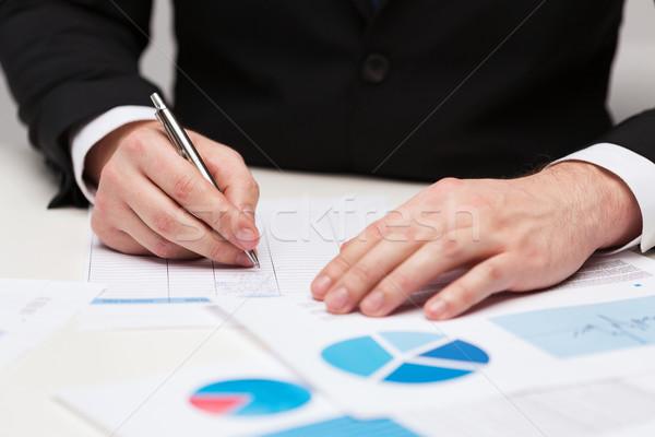 close up of businessman with papers Stock photo © dolgachov