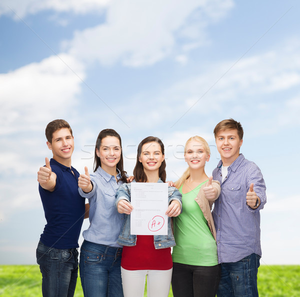 group of students showing test and thumbs up Stock photo © dolgachov