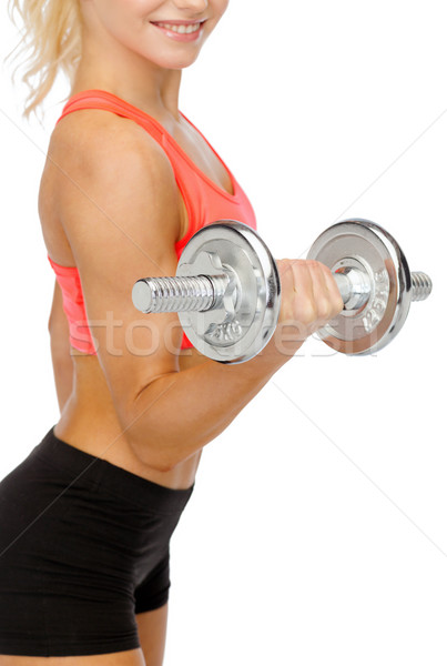 close up of sporty woman with heavy steel dumbbell Stock photo © dolgachov