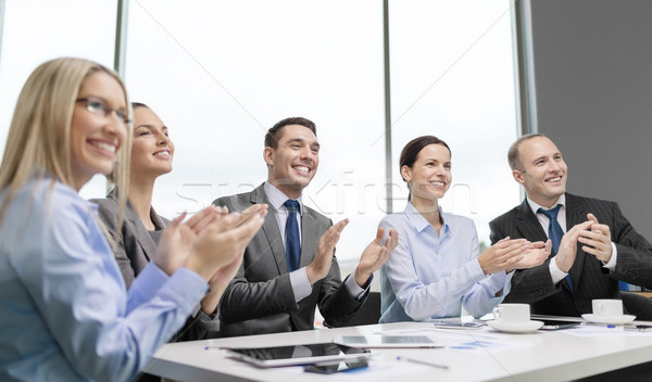 business team with laptop clapping hands Stock photo © dolgachov