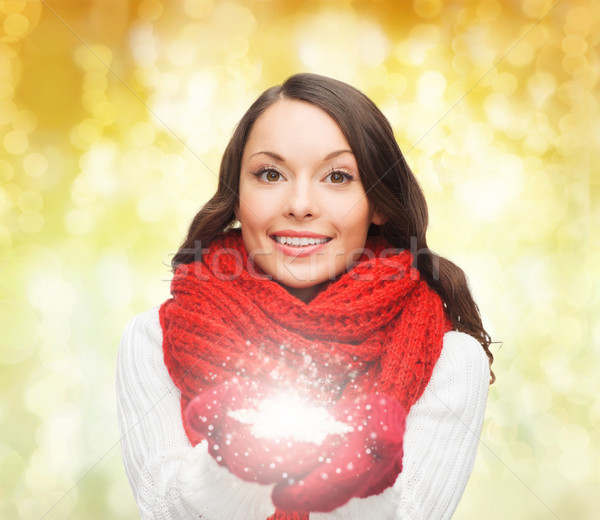 Stock photo: smiling woman in winter clothes with snowflake