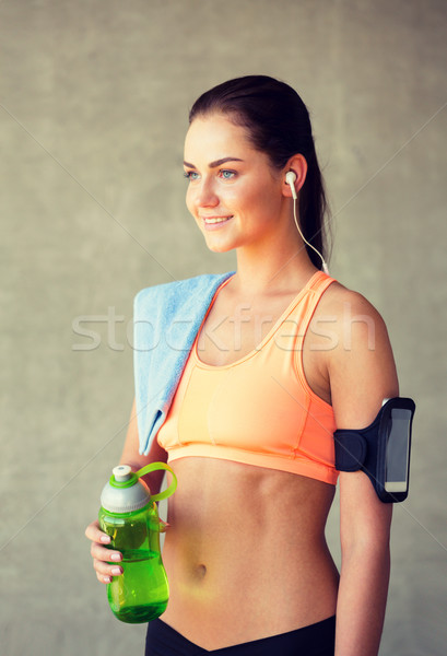 woman with bottle of water in gym Stock photo © dolgachov