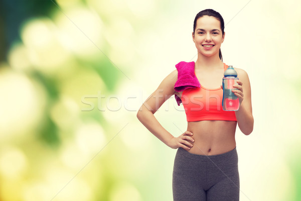 Femme serviette une bouteille d'eau sport exercice [[stock_photo]] © dolgachov