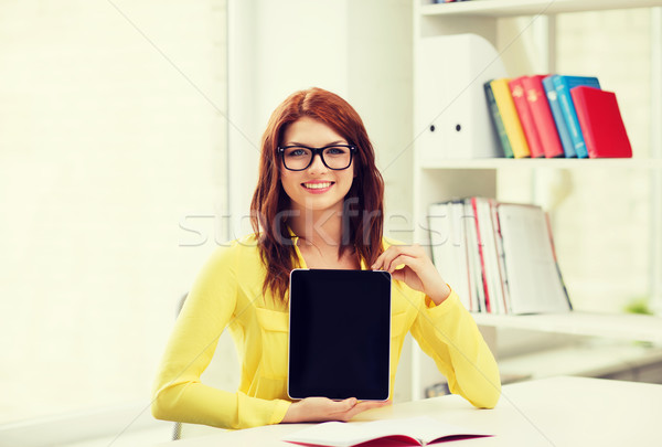 Stock photo: smiling student girl in eyelgasses with tablet pc