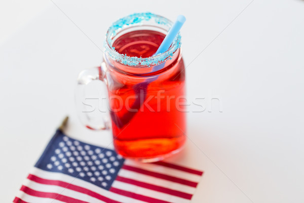 juice glass and american flag on independence day Stock photo © dolgachov