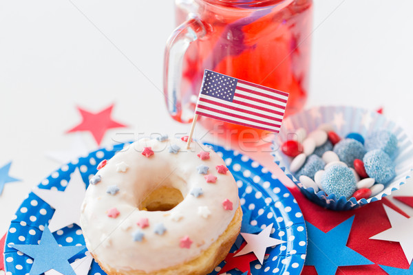 donut with juice and candies on independence day Stock photo © dolgachov