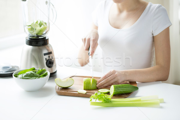 close up of woman with blender chopping vegetables Stock photo © dolgachov
