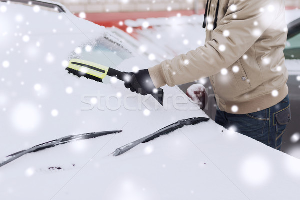 closeup of man cleaning snow from car Stock photo © dolgachov