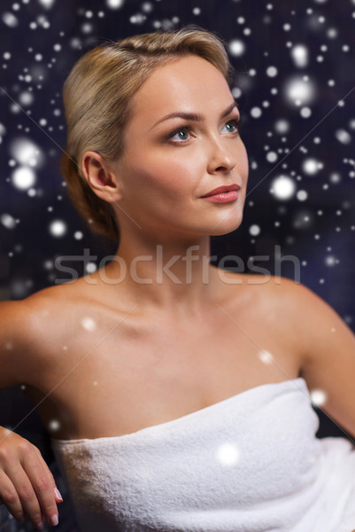 beautiful woman sitting in bath towel at sauna Stock photo © dolgachov