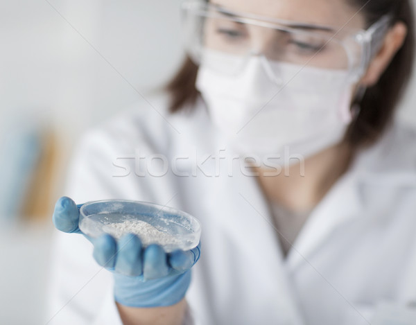 close up of scientist holding petri dish in lab Stock photo © dolgachov