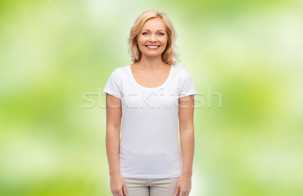 smiling middle aged woman in blank white t-shirt Stock photo © dolgachov