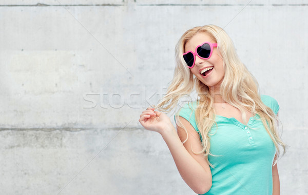 Stock photo: happy young blonde woman or teenager in sunglasses