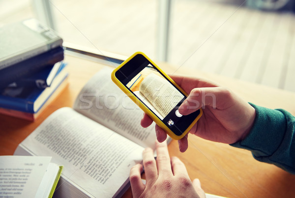 student hands with smartphone making cheat sheet Stock photo © dolgachov