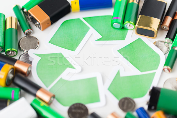 close up of batteries and green recycling symbol Stock photo © dolgachov