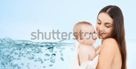 happy mother holding adorable baby Stock photo © dolgachov