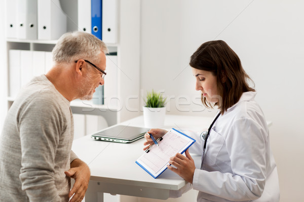 senior man and doctor meeting at hospital Stock photo © dolgachov