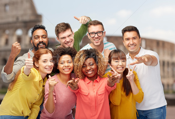 international people showing thumbs up at coliseum Stock photo © dolgachov
