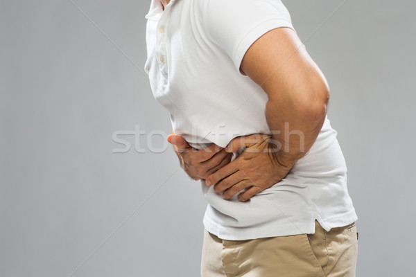 Człowiek cierpienie ból brzucha ludzi opieki zdrowotnej Zdjęcia stock © dolgachov