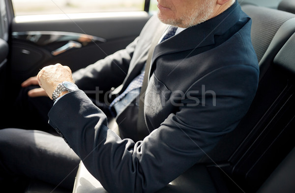старший бизнесмен вождения автомобилей назад сиденье Сток-фото © dolgachov