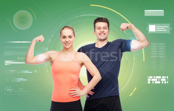 Szczęśliwy człowiek kobieta biceps moc Zdjęcia stock © dolgachov