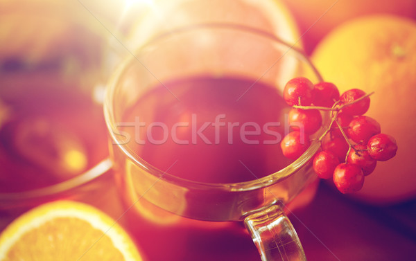 close up of tea cup with rowanberry Stock photo © dolgachov