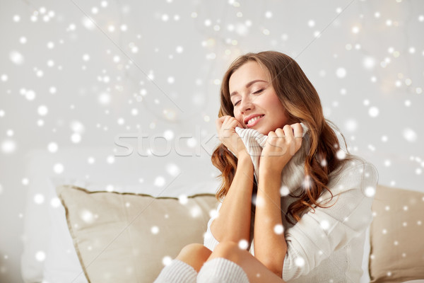 happy young woman in warm pullover at home Stock photo © dolgachov